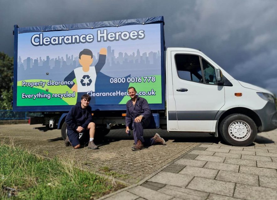 Clearance Heroes Team Members Smiling With Van