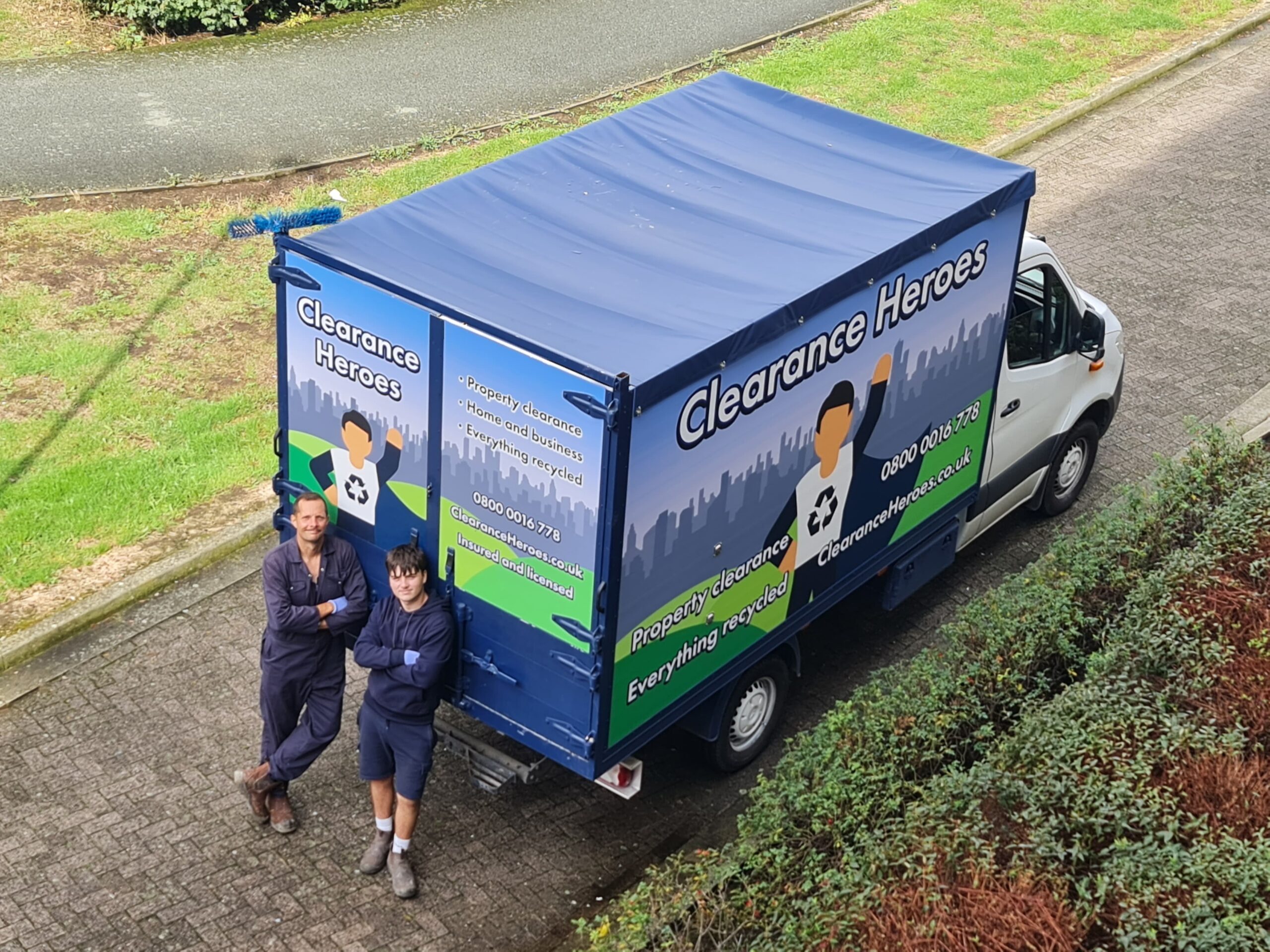 Clearance Heroes Team Members With Van Smiling